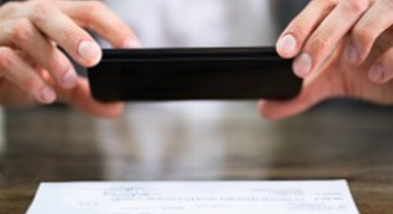 Person using mobile check deposit