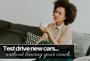 Woman sitting on the couch. Test drive new cars in your home with AutoLink!