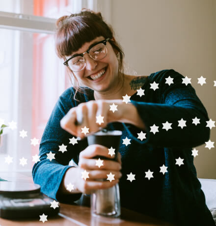 Woman opening something in the kitchen.